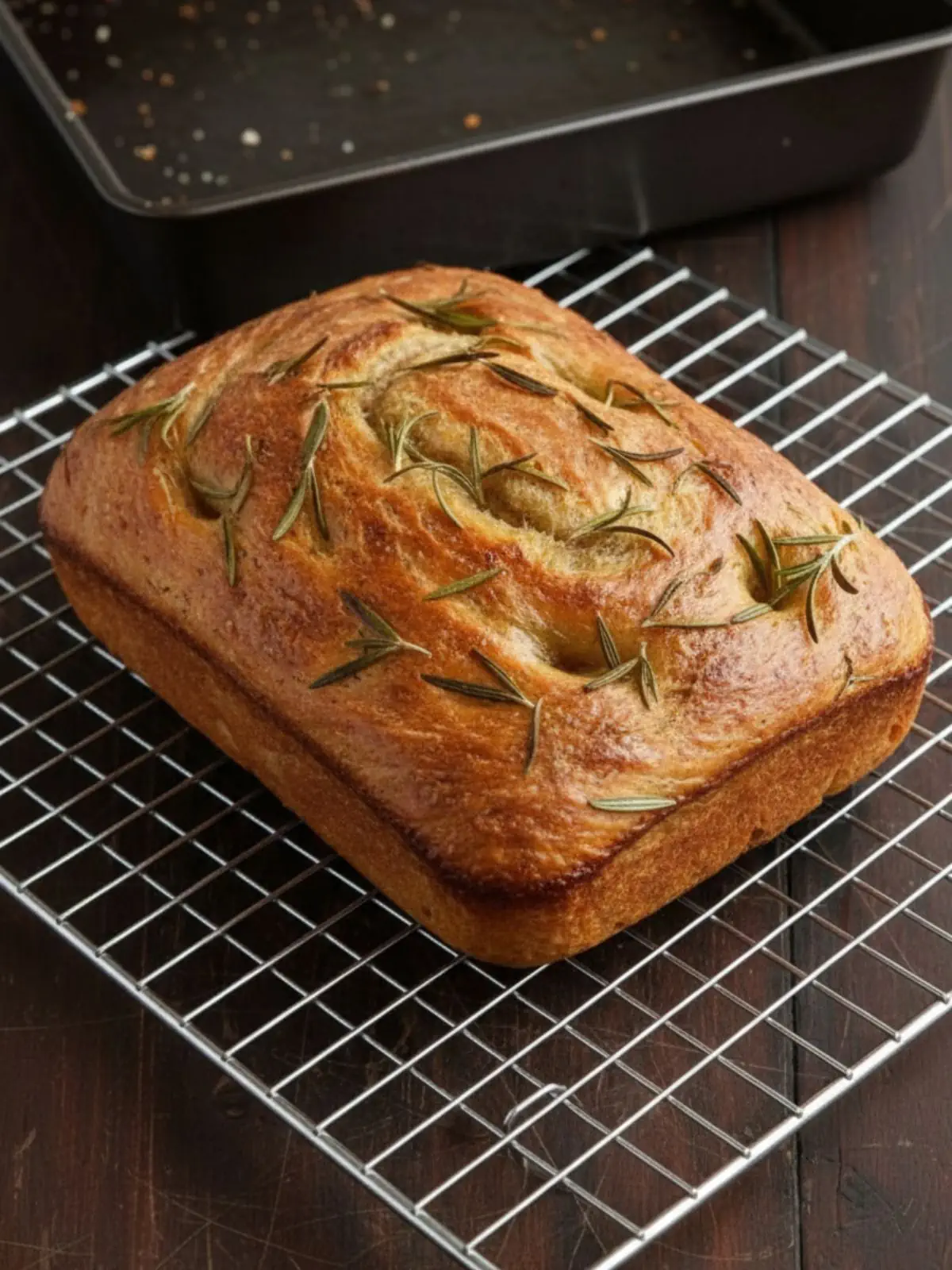 Focaccia Bread Recipe Full overnight focaccia bread recipe baked until golden brown with deep dimples, olive oil sheen, flaky sea salt, and rosemary in a 9 x 13-inch pan.